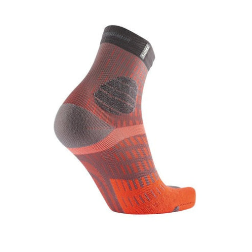 Orange and gray Sidas sock on a white background